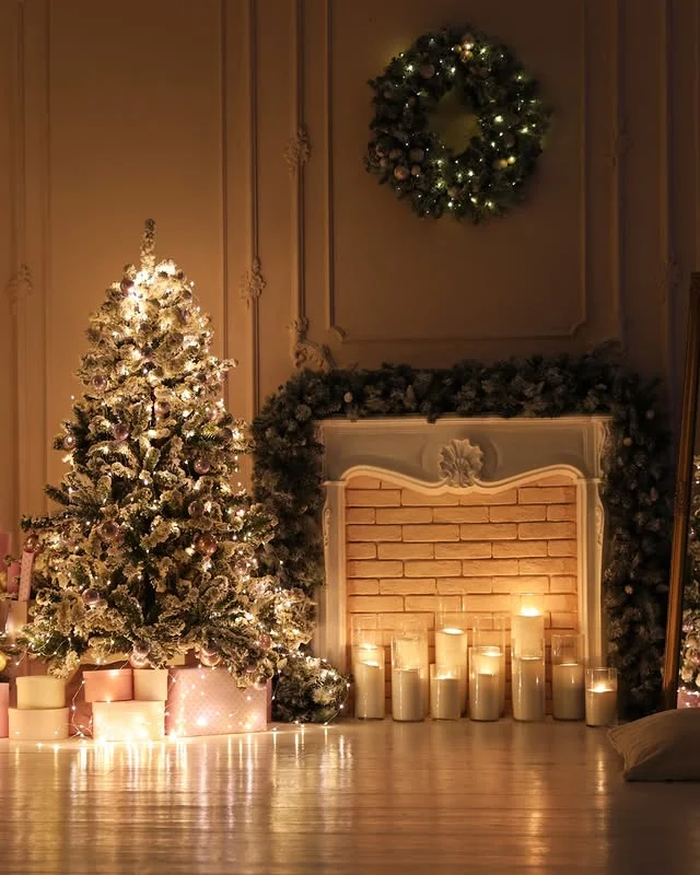 Flocked Christmas tree with glowing candles in an elegant living room