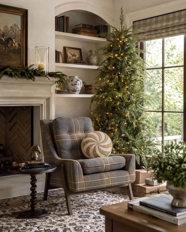 Plaid armchair reading nook next to a lit Christmas tree