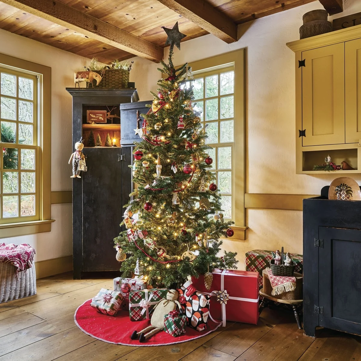 Rustic christmas tree with pinecones, red glass ornaments and vintage figurines