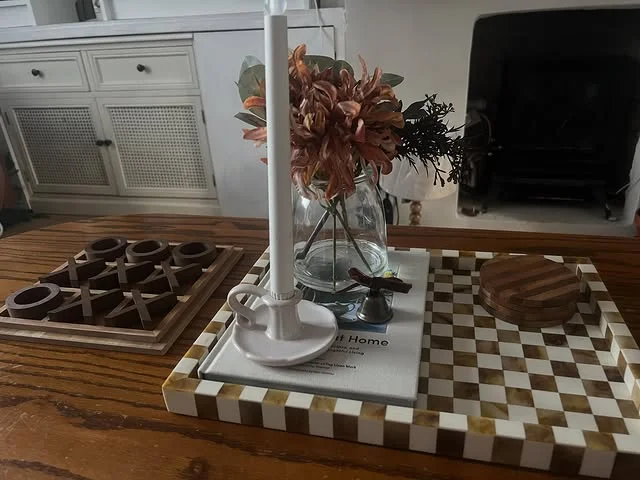 Styled coffee table with tray, books, and decor