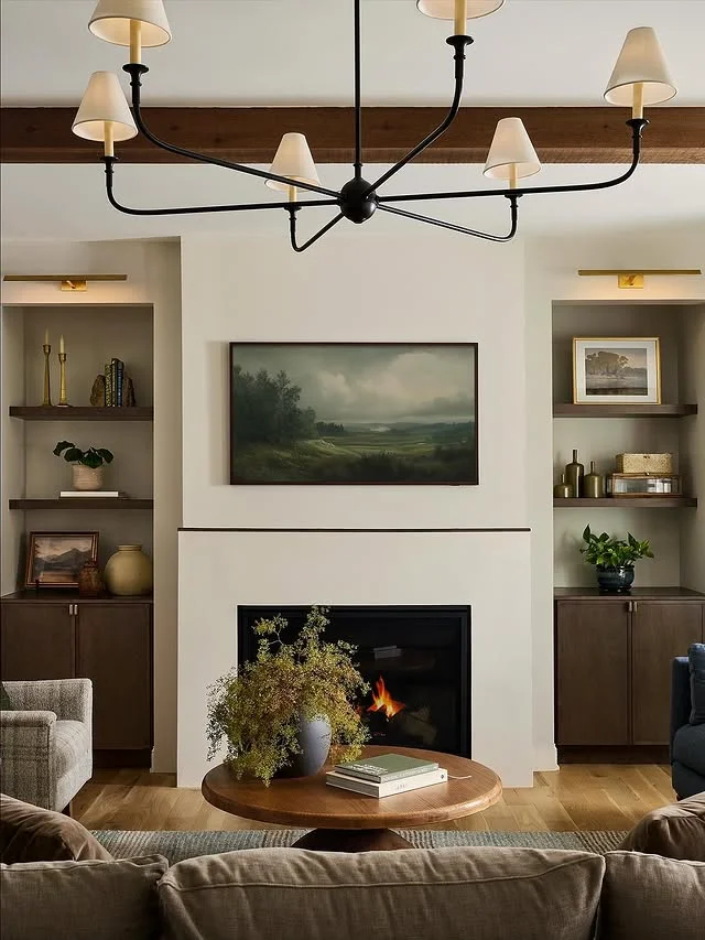 Styled fireplace mantel with art and built-in shelves