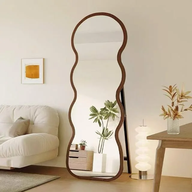 Bright living room with a tall decorative mirror