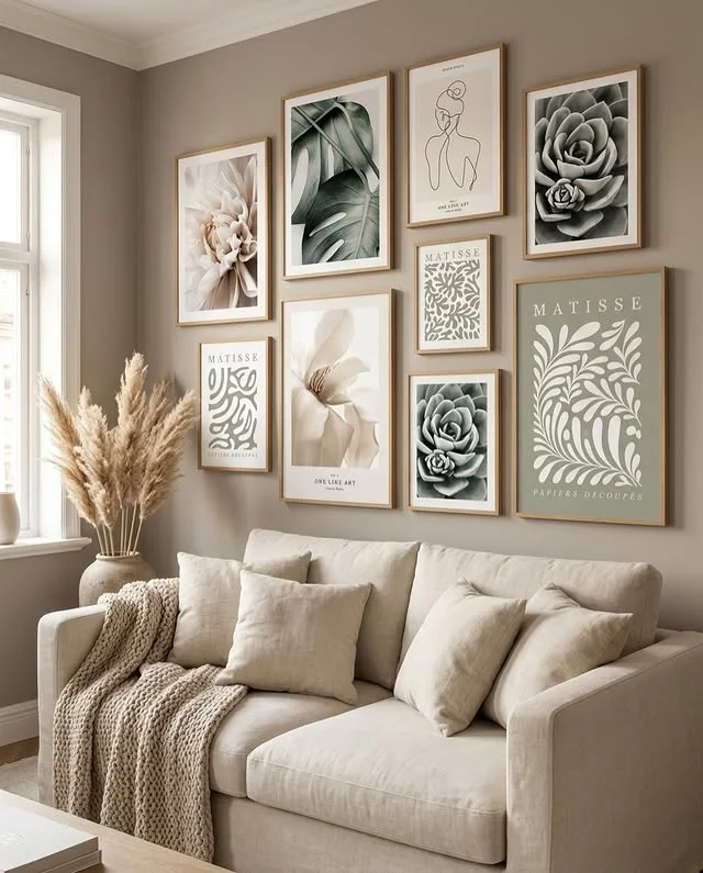Gallery wall of framed art above a sofa