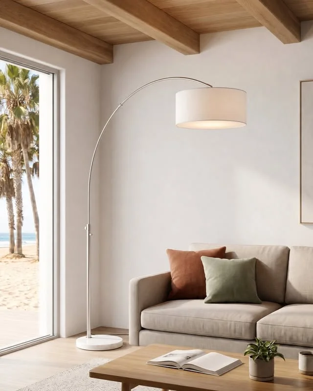 Arc floor lamp beside a neutral sofa