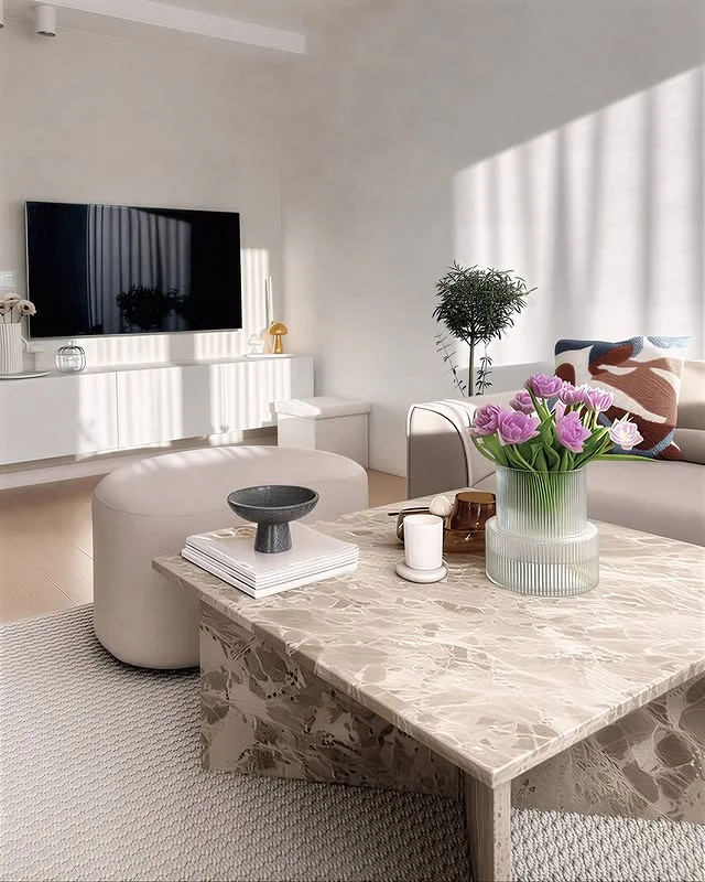 Modern living room with marble coffee table and fresh flowers