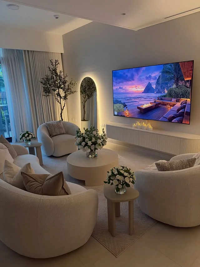 Curved boucle seating around a modern media wall setup